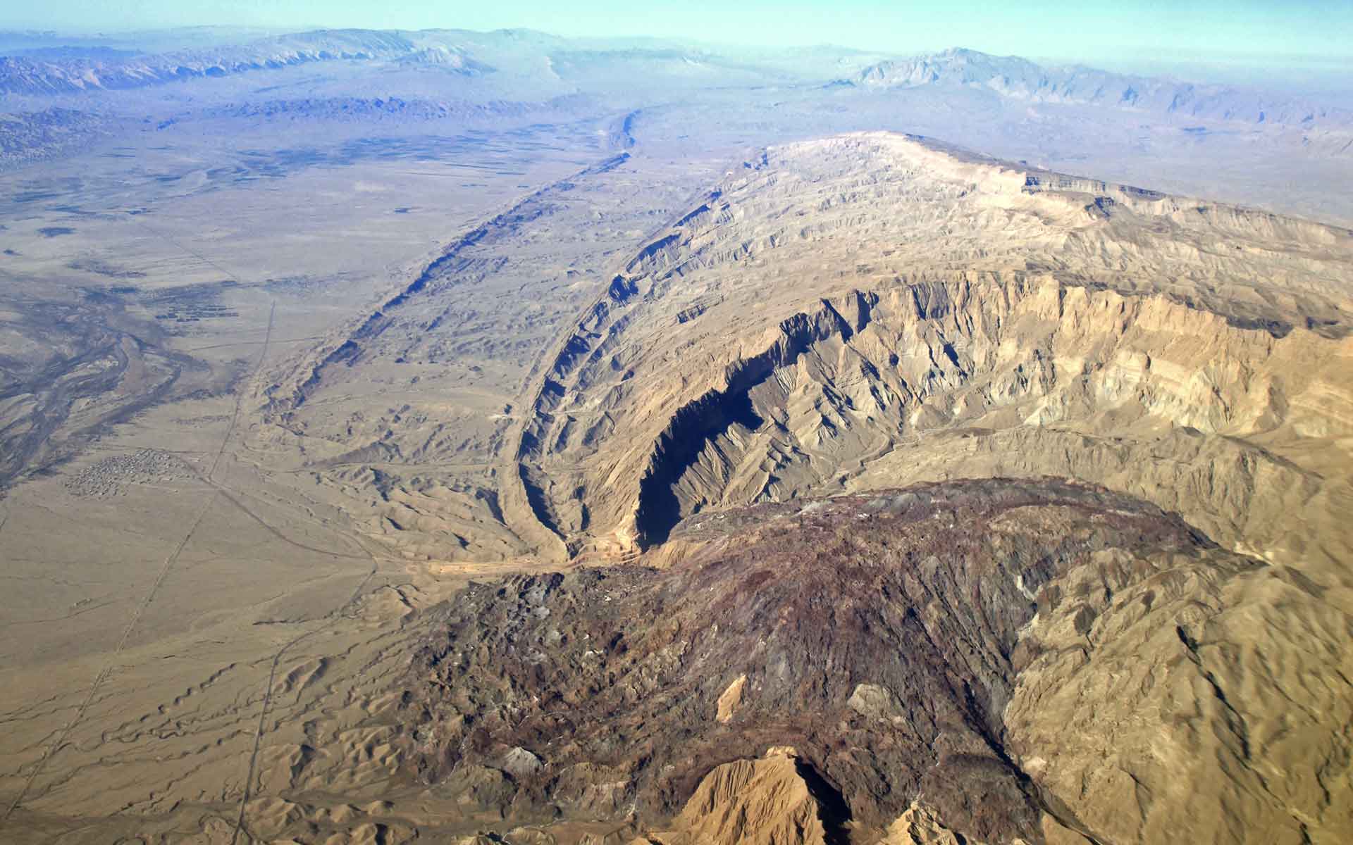 Ediacaran-Early Cambrian Hormuz salt extruded in the eroded core of a whale-back anticline of the Zagros mountain of southern Iran. The folded strata belong to Cretaceous to Pliocene sequence.